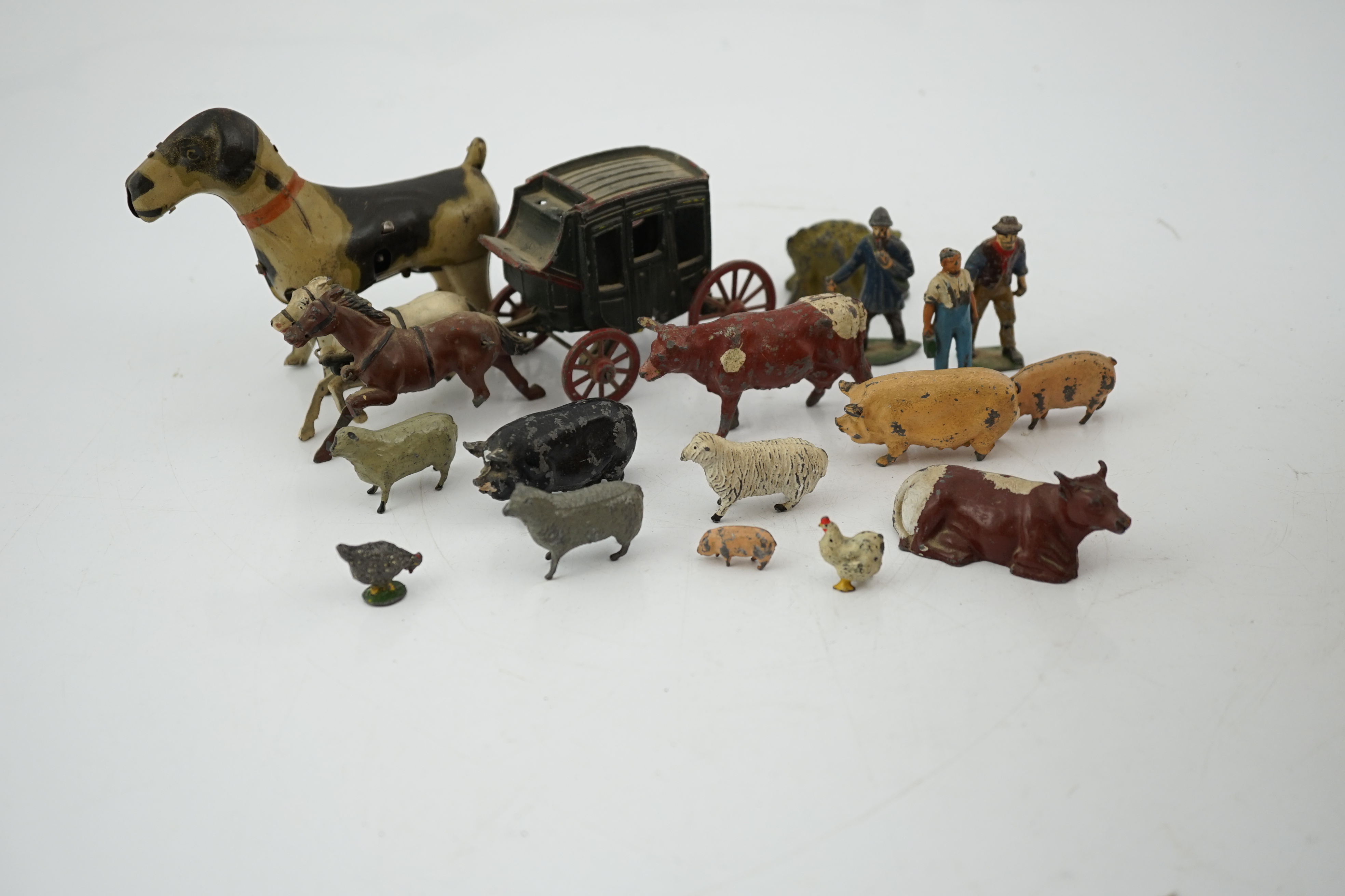 A collection of Britains, etc. lead farm animals and accessories, including the farmer, farmer’s wife, a coach and horses and other figures